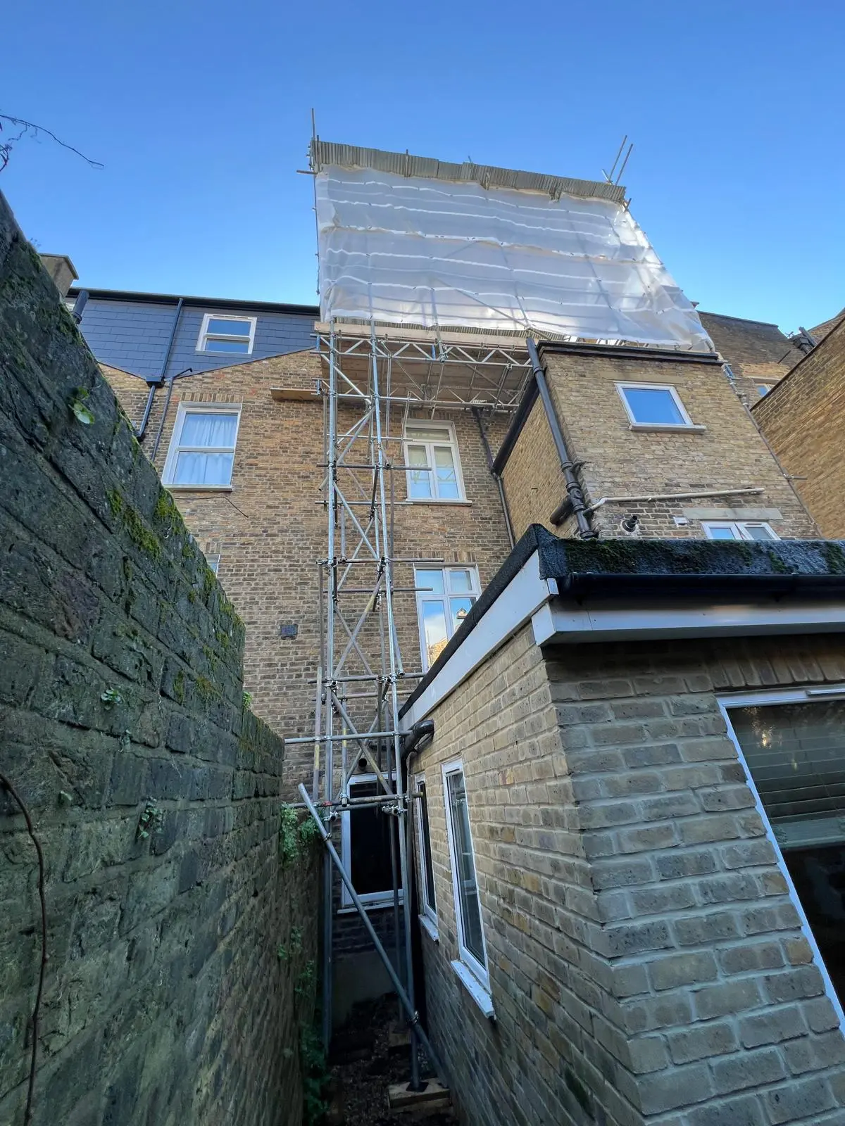 Scaffolding installed in a restricted side passage